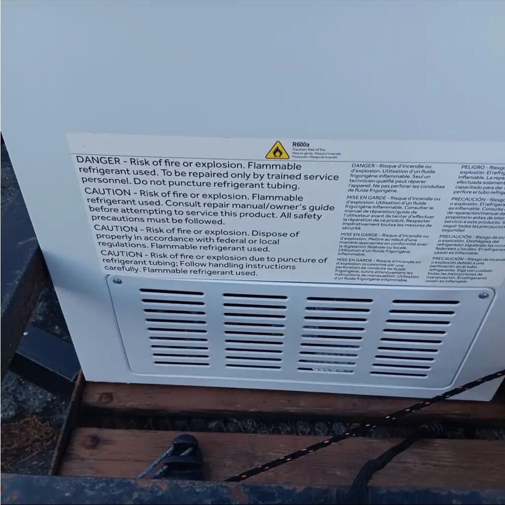 White Appliance with Safety Labels